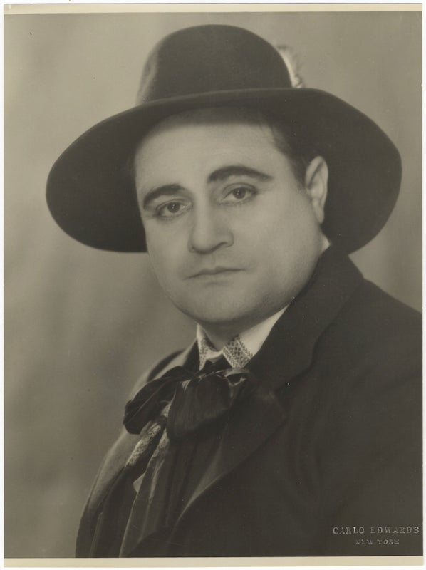Item #24679 Original bust-length photograph by Carlo Edwards, New York, of the celebrated Italian tenor with hat and cravat. Beniamino GIGLI.