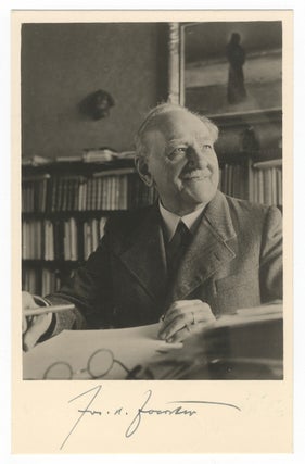 Item #25422 Bust-length vintage postcard photograph of the composer seated with pen poised over...