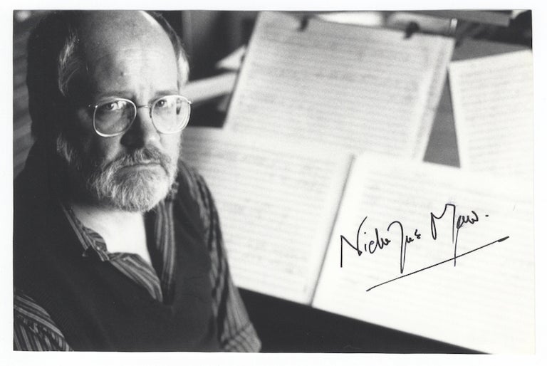 Item #25458 Bust-length portrait photograph of the English composer depicted seated with musical scores in background. Signed. Nicholas MAW.