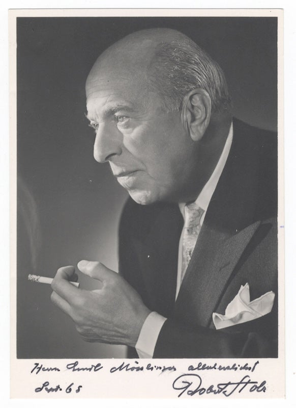 Item #25477 Bust-length photograph of the noted Austrian composer and conductor in formal attire, cigarette in hand, signed, inscribed "Herrn Emil Mösslinger allerherzlichst," and dated September [19]65. Robert STOLZ.