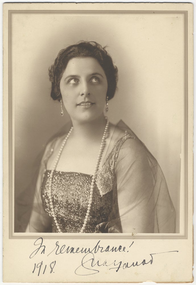 Item #29381 Fine large bust-length photograph of the famed soprano in formal dress boldly signed "In remembrance!... 1918." Geraldine FARRAR.