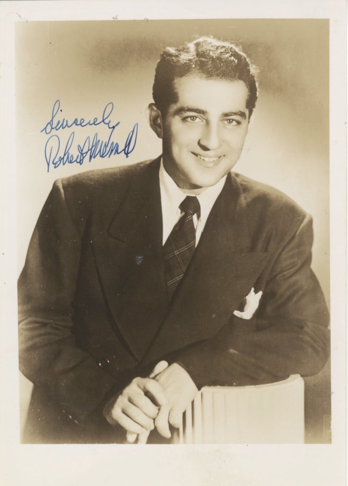 Item #31829 Studio portrait photograph with autograph signature of the noted American baritone. Robert MERRILL.