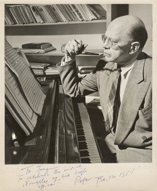 Item #39025 Photograph of Sessions seated at the piano, pen in hand, with sheets of. Roger SESSIONS