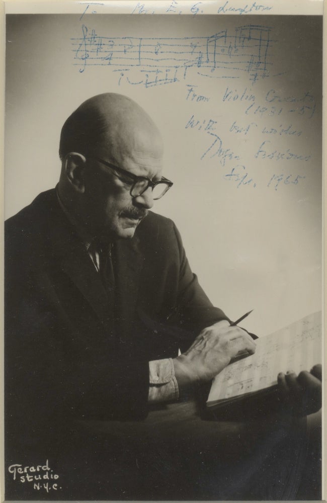 Item #39051 Photograph of the composer, manuscript in hand, with autograph musical quotation from his Violin Concerto signed in full. Roger SESSIONS.