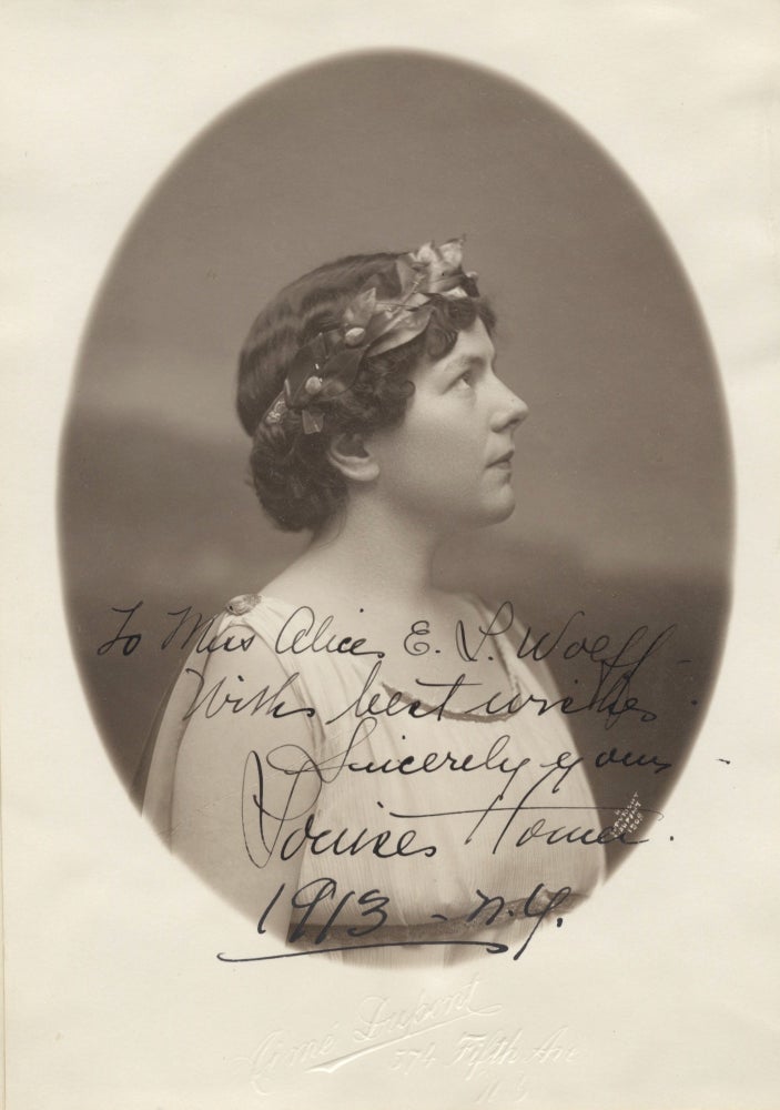 Item #39149 Bust-length oval photograph of the American contralto in profile with a garland in her hair with autograph signature. Louise HOMER.