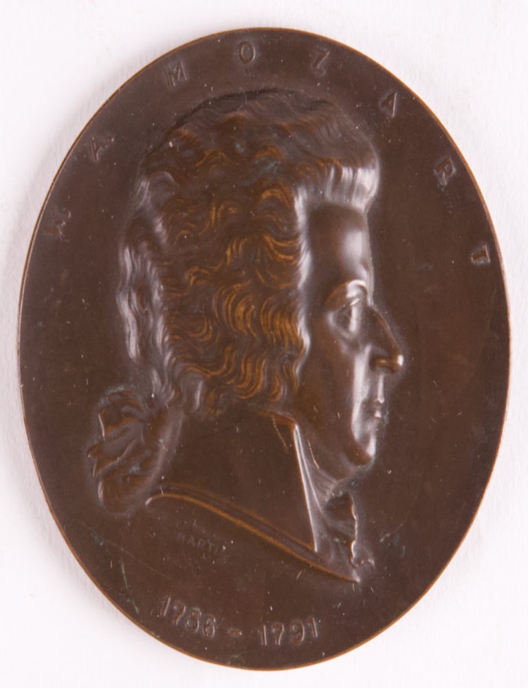 Item #40238 Circular bronze medal with relief portrait of Mozart in profile designed by A. Hartig after the Leonhard Posch wax profile of 1788. Issued in 1956 to celebrate the 200th anniversary of the composer's birth. Wolfgang Amadeus MOZART.
