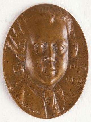 Item #40240 Bronze medal head-and-shoulders relief portrait of Mozart at 6 years of age. Designed...